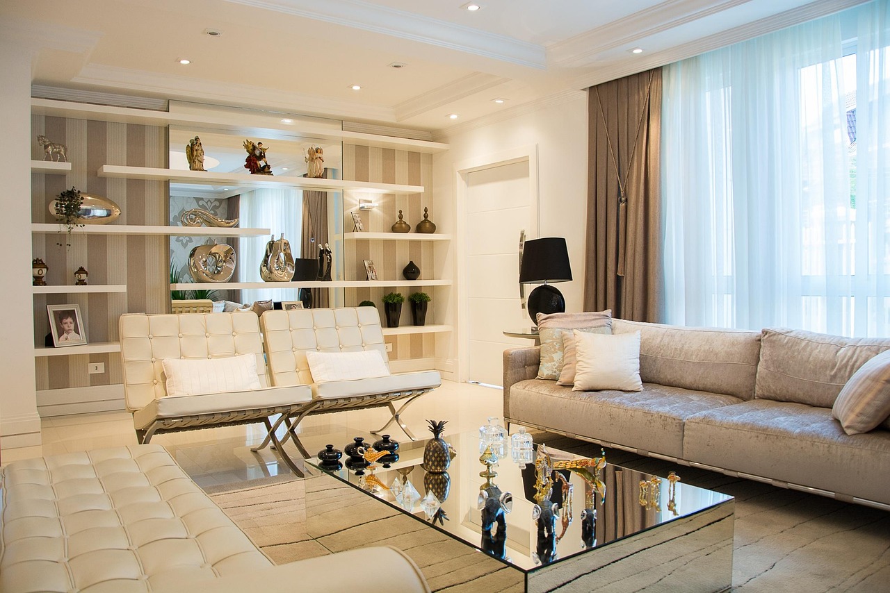 Formal living room with built-in shelving and cream sofas